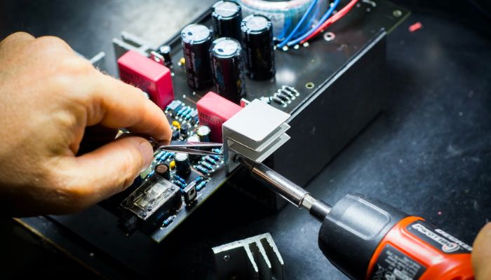 A worker preparing computer hardware